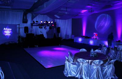 The Prom room is gorgeous as it glows brightly with the purple uplights surrounding the dance floor beside the 10 foot video screen and the massive array of lights and special effects in Fort Smith, Arkansas.