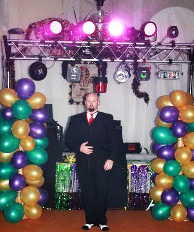 The DJ, Sean Hearn, sports his tux and black and white ganster spats in front of the huge display of lights and special effects ready for the High School Prom Students to come and dance.