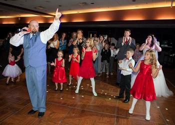 The Entertainer DJ Sean Hearn at a wedding reception in Fort Smith, Arkansas gets out on the dance floor and teaches the line dance: Cha Cha Slide, to the bride, groom and all of the guests.