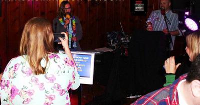 Guy sings a David Allen Coe karaoke song at a 50th birthday celebration at club seventy1 in Springdale, AR.
