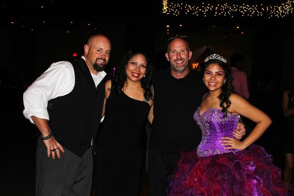 Birthday Girl, Vanessa Smith and her parents Mark and Adela, smile for a picture with the DJ from Music In Motion: DJSean Hearn, during her Quinceanera at the Event Place on Wedding in Fayetteville Arkansas.
