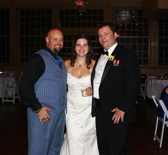 DJSean with Music In Motion poses for a picture with the bride and groom: John and Carody Kean at the Basin Park Hotel in downtown Eureka Springs Arkansas.