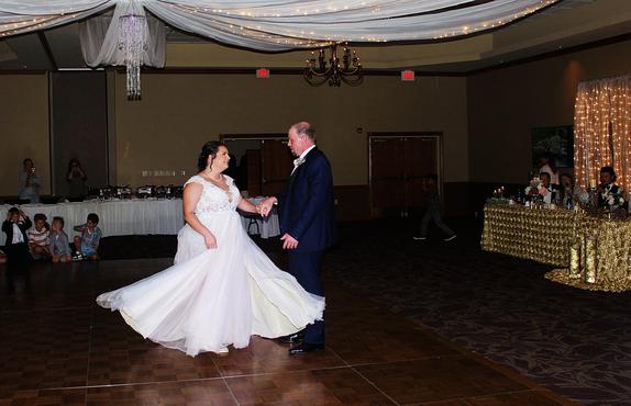 Nick and Erika Melber enjoy their first dance as Husband and Wife during their Karaoke Wedding Reception at the Best Western Inn of the Ozarks in Eureka Springs Arkansas.