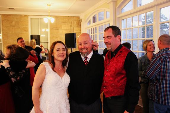 After a lovely ceremony at Thorncrown Chapel, Brad and Keelin Eggleston take a break during their fun filled reception at the Crescent Hotel to pose for a Picture with DJSean, their entertainer with Music in Motion out of Fayetteville Arkansas.