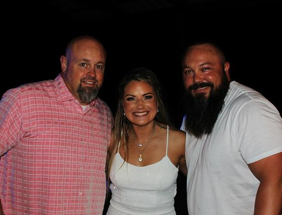 Derik and Courtney Corder pose with the Mobile Entertainer DJSean Hearn during their Wedding Reception at Hidden Falls Venue in Gravette Arkansas