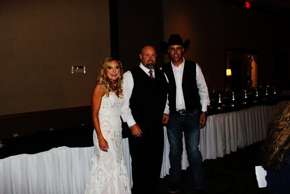 Gary and Janelle Forsythe pose for a picture with their DJ DJSean during their wedding reception at the Inn of the Ozarks in Eureka Springs Arkansas.
