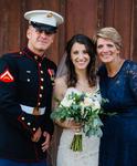 Pebi Elliott standing with her daughter and new son-in-law, dressed handsomely in his military attire outside the wedding reception hosted by DJSean Hearn.